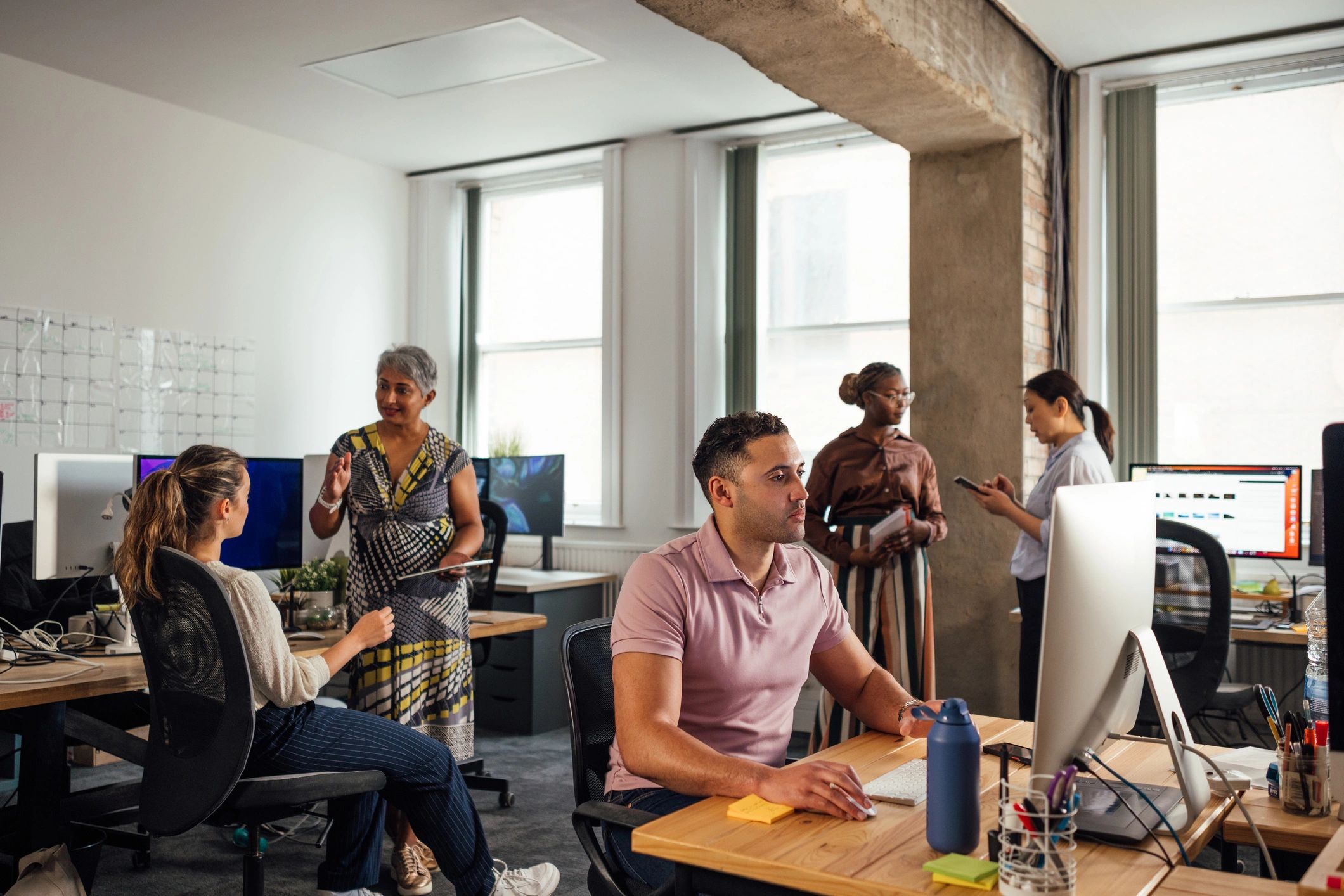 Corporate team collaborating in a modern office